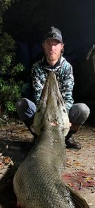 A solitary angler fishing in an orange location