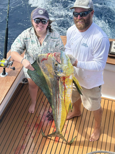 Fisherman holding a 27-inch fish in Nags Head, North Carolina