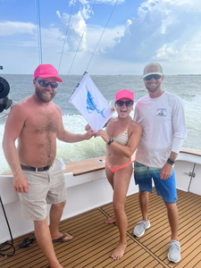 A group of 4 people enjoying a fishing trip at Nags Head