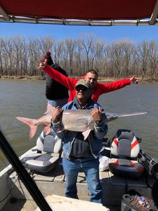 Two people enjoying a fishing trip in Sand Springs