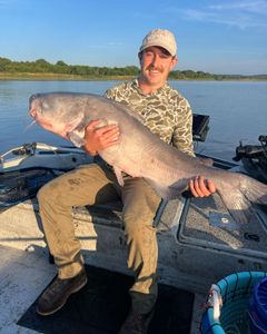 Angler with a big blue catfish caught in Sand Springs