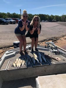 Two people enjoying a fishing trip in OK