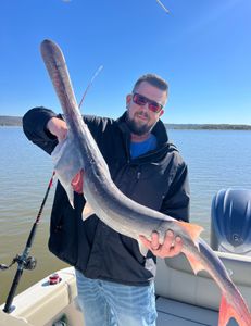 Person fishing on the sand at Sand Springs