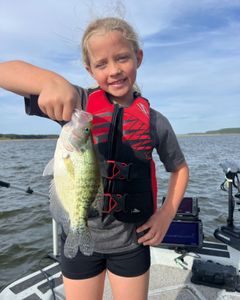 Angler holding a white crappie fish caught in Sand Springs