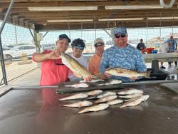 Anglers with a pair of redfish caught in TX