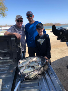 Three people enjoying a fishing trip in TX