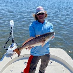 Two anglers fishing in Florida with a 23-inch catch