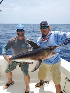 Swordfish catch displayed on fishing boat deck in Bridge FL waters