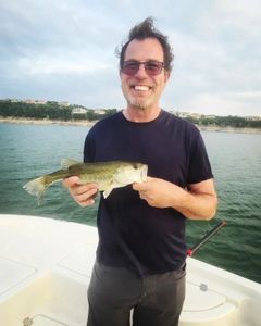 Angler catches a largemouth bass in TX