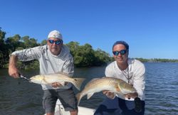 Two anglers fishing in Naples, Florida with a great catch