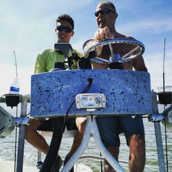 Two people fishing on the shore in FL