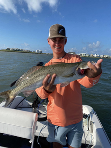An angler holding a fishing rod in Gulf Shores