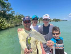 4 people enjoying a fishing trip in FL
