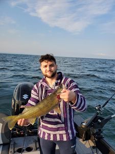 Angler catching a fish in NY
