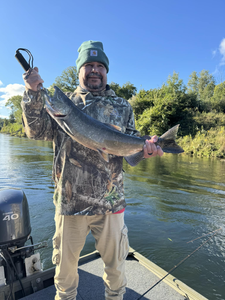 Angler holding a freshly caught rainbow trout