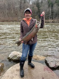Photograph of a rainbow trout caught by a person in Michigan