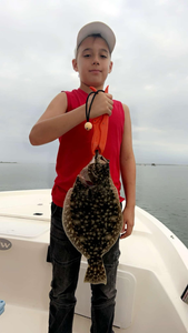 Fisherman holding 18-inch catch in North Carolina
