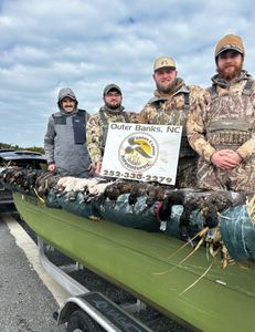 Four friends enjoying a fishing and hunting adventure in Wanchese