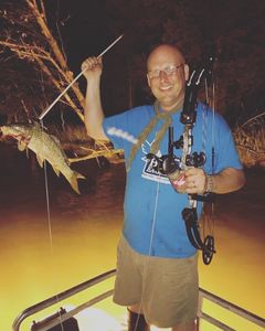 A person fishing in Nolensville, with a small fish catch