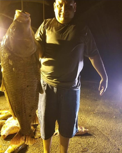 A person fishing in Nolensville with a 36-inch fish