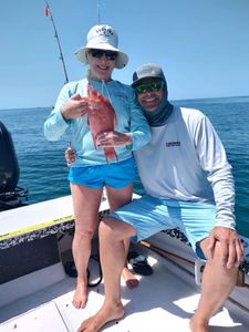 Two people fishing in the bay at Bay Pines
