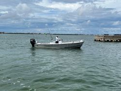 Person fishing on the shore of Bay Pines