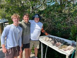 Three people enjoying a fishing trip at Bay Pines