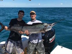Two people fishing with a rod in Port Orange