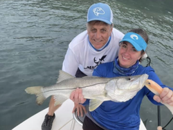 Two people enjoying a fishing trip at Port Orange