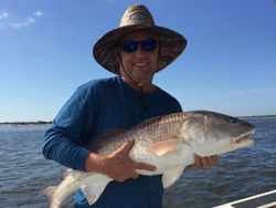 A person fishing with a rod in Port Orange
