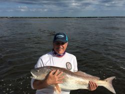 A group of 3 people fishing in Florida