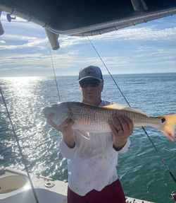 Angler with a redfish in Port Orange