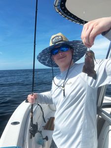 Single fisherman holding a 41-inch catch in GA