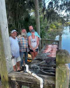 Four people enjoying a fishing tour in GA