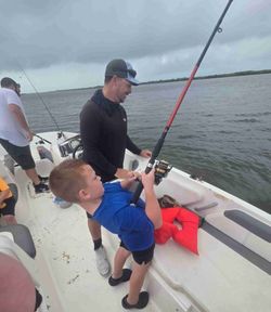 Two people enjoying a fishing tour in Daytona Beach