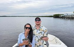 Two people enjoying a fishing tour in Florida