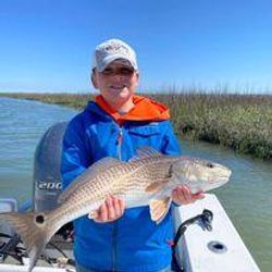 Angler holding a 27-inch fish in SC