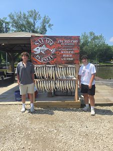 Two people fishing in MI