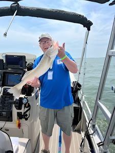 Angler holding a fishing rod in MI