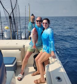 Two anglers enjoying a fishing trip at Fort Walton Beach