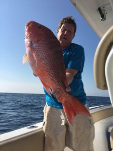 A pair of anglers reeling in their catch in Florida
