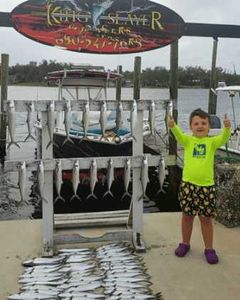 Angler posing with a 49-inch catch at Panama City Beach