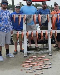 Five people enjoying a great fishing trip in Panama City Beach