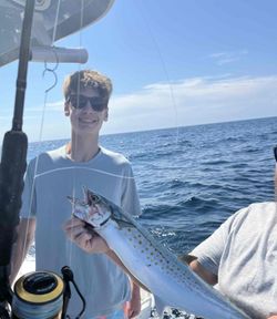 Fisherman holding a Spanish Mackerel in Panama City Beach
