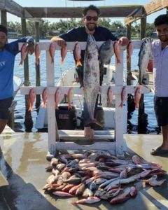 Two fishing rods with 2 big fish caught at Panama City Beach