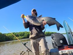 Angler with a freshwater fishing rod enjoying the outdoors in NC