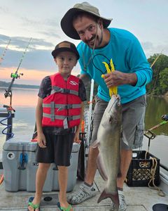 Angler holding a huge blue catfish in NC