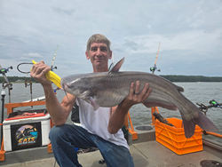 Huge 32-inch Blue Catfish reeled in during a partly cloudy day with rain!