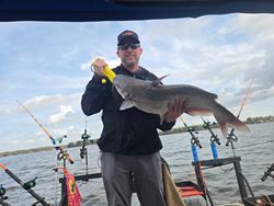 Angler holding a large blue catfish in North Carolina