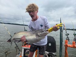 A person fishing for a blue catfish in North Carolina